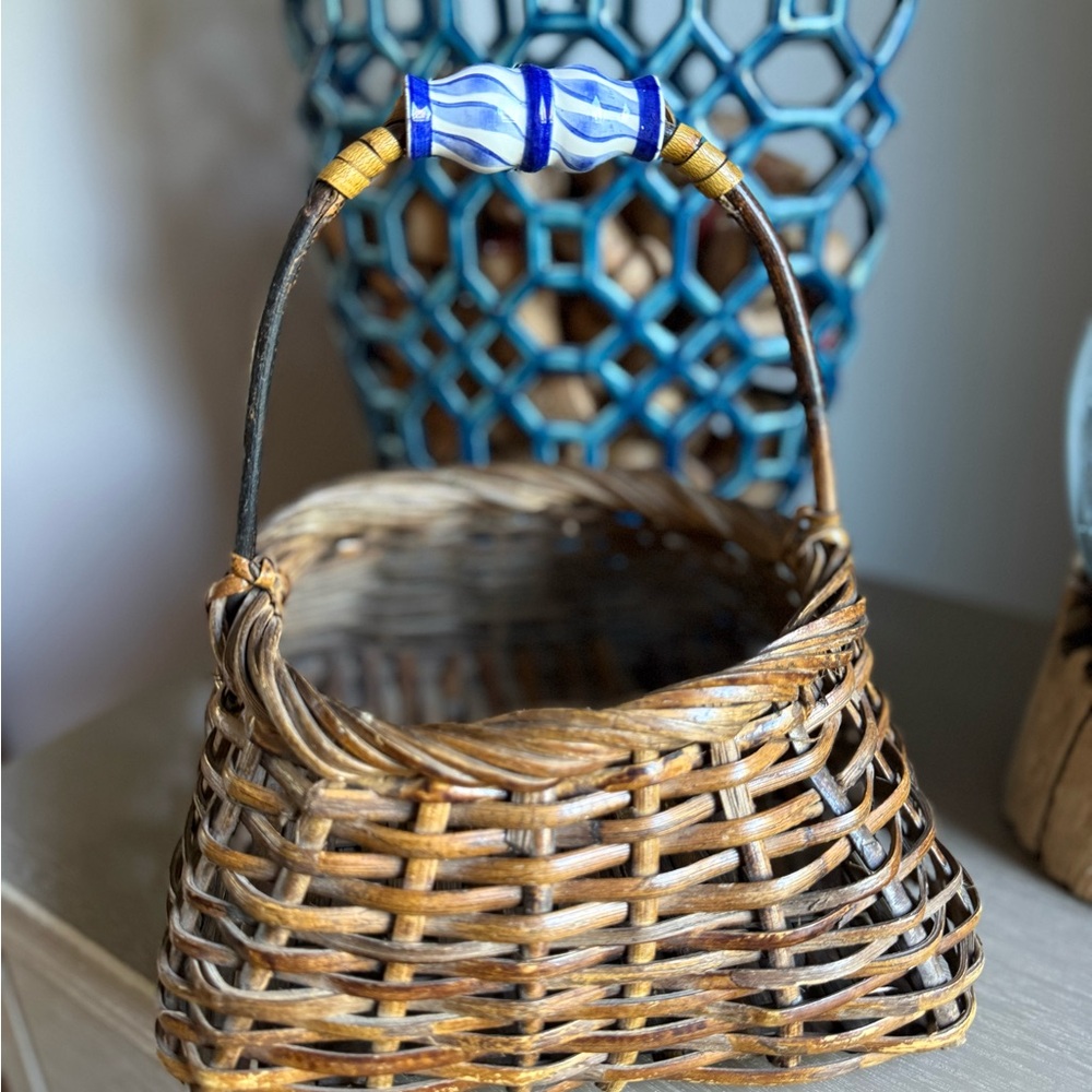 Hand made vintage wicker basket with ceramic painted delft style handle